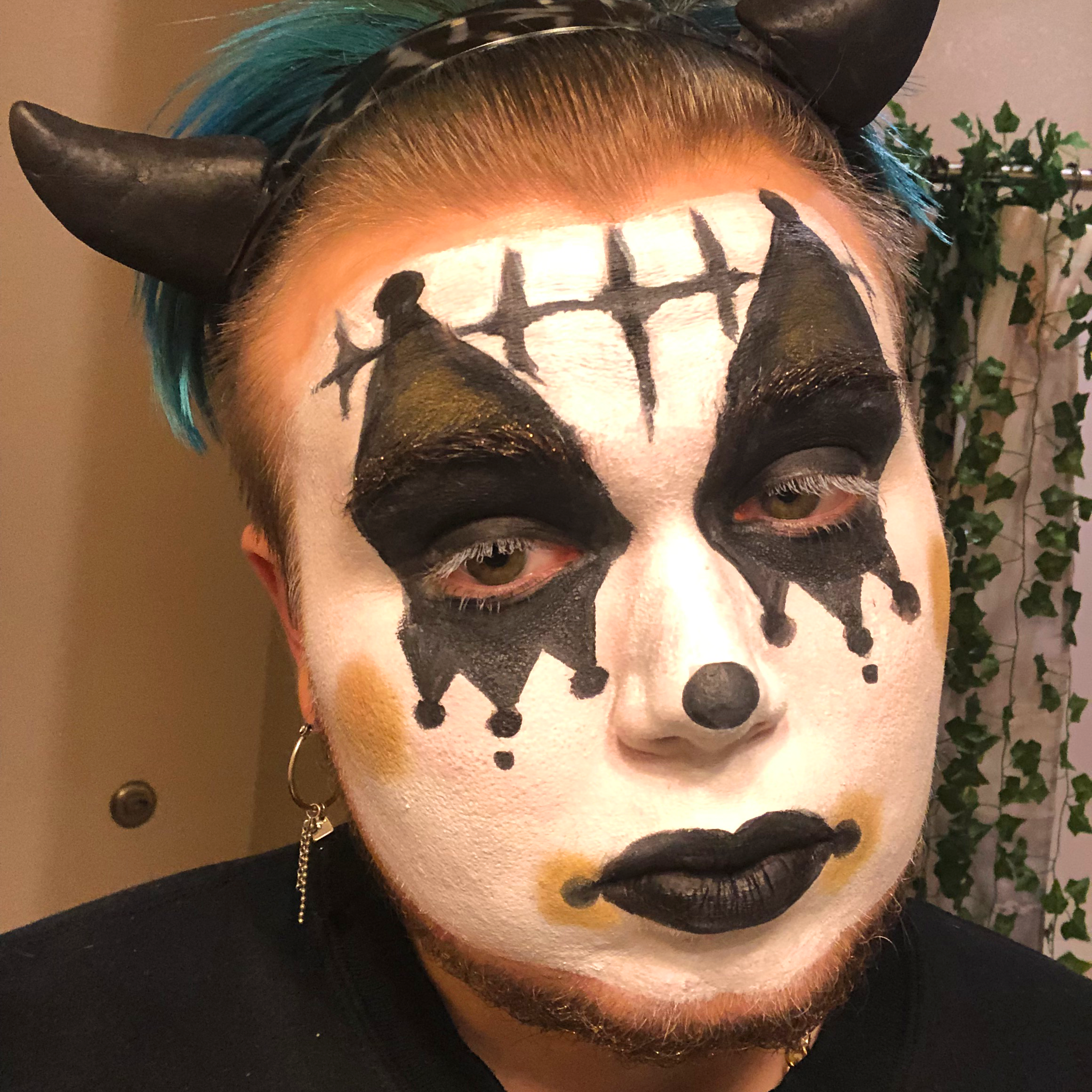 Individual in clown makeup.